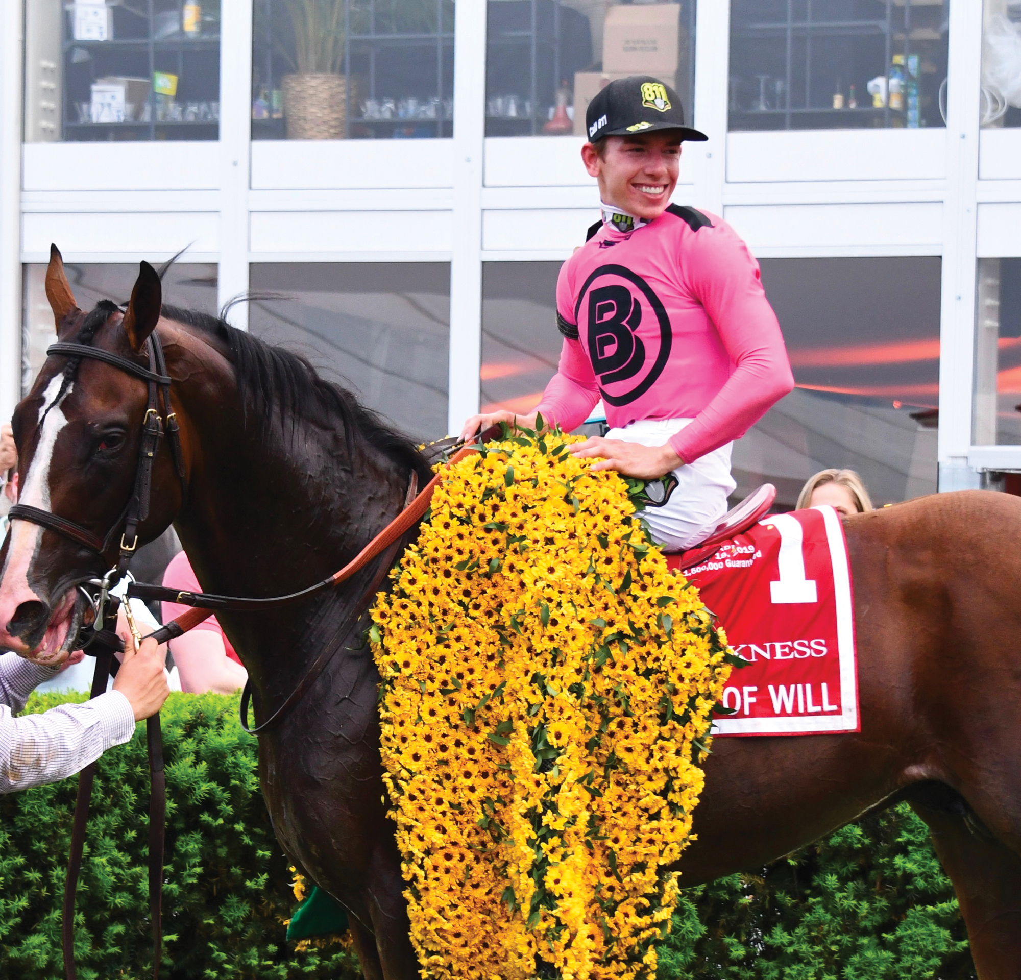 Tyler Gaffalione wearing 811 hat after Preakness